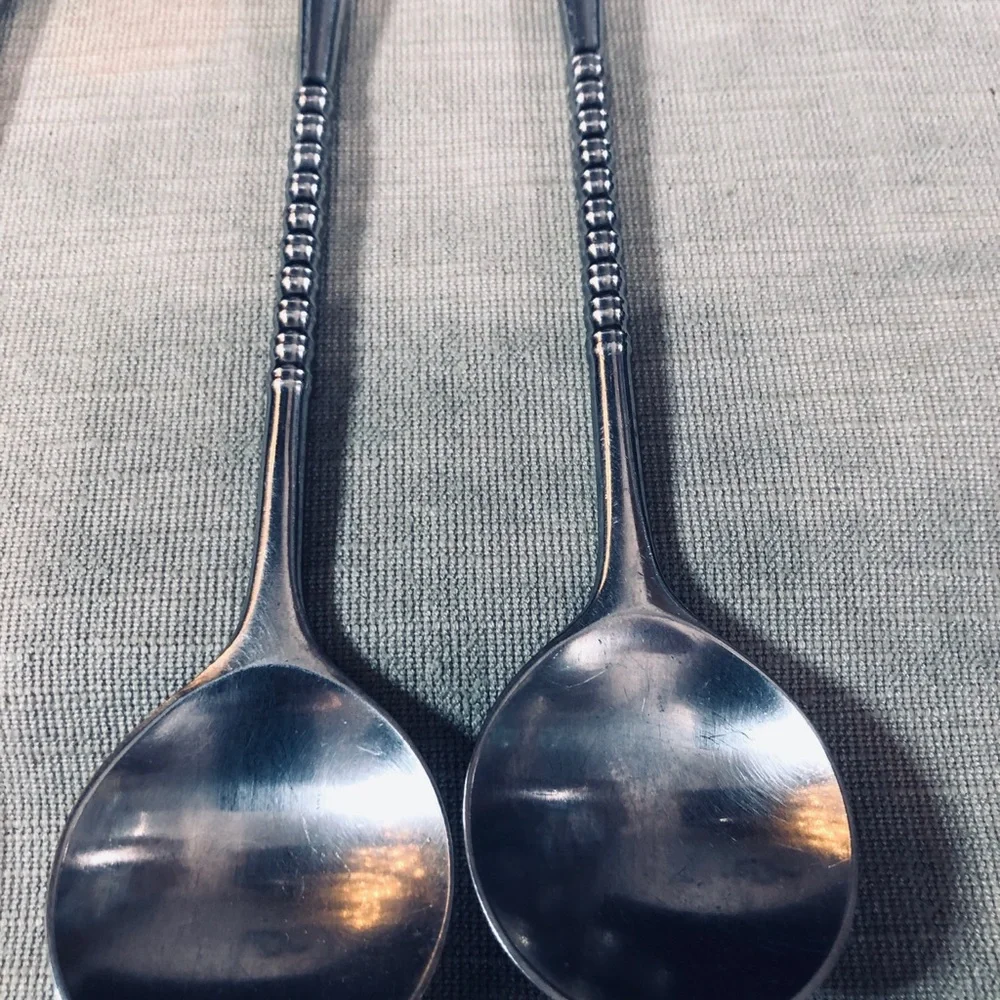 Set of Dansk Jette Stainless Steel flatware and / Four Stainless Steel Pegs